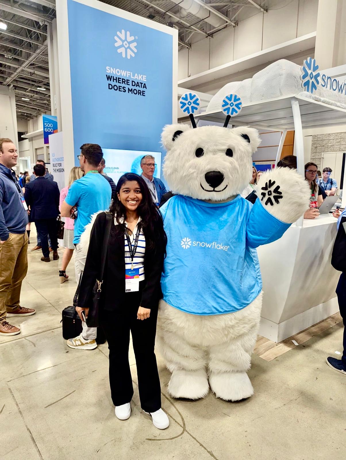 AWS Summit 2025 - Adonia with Snowflake mascot at expo